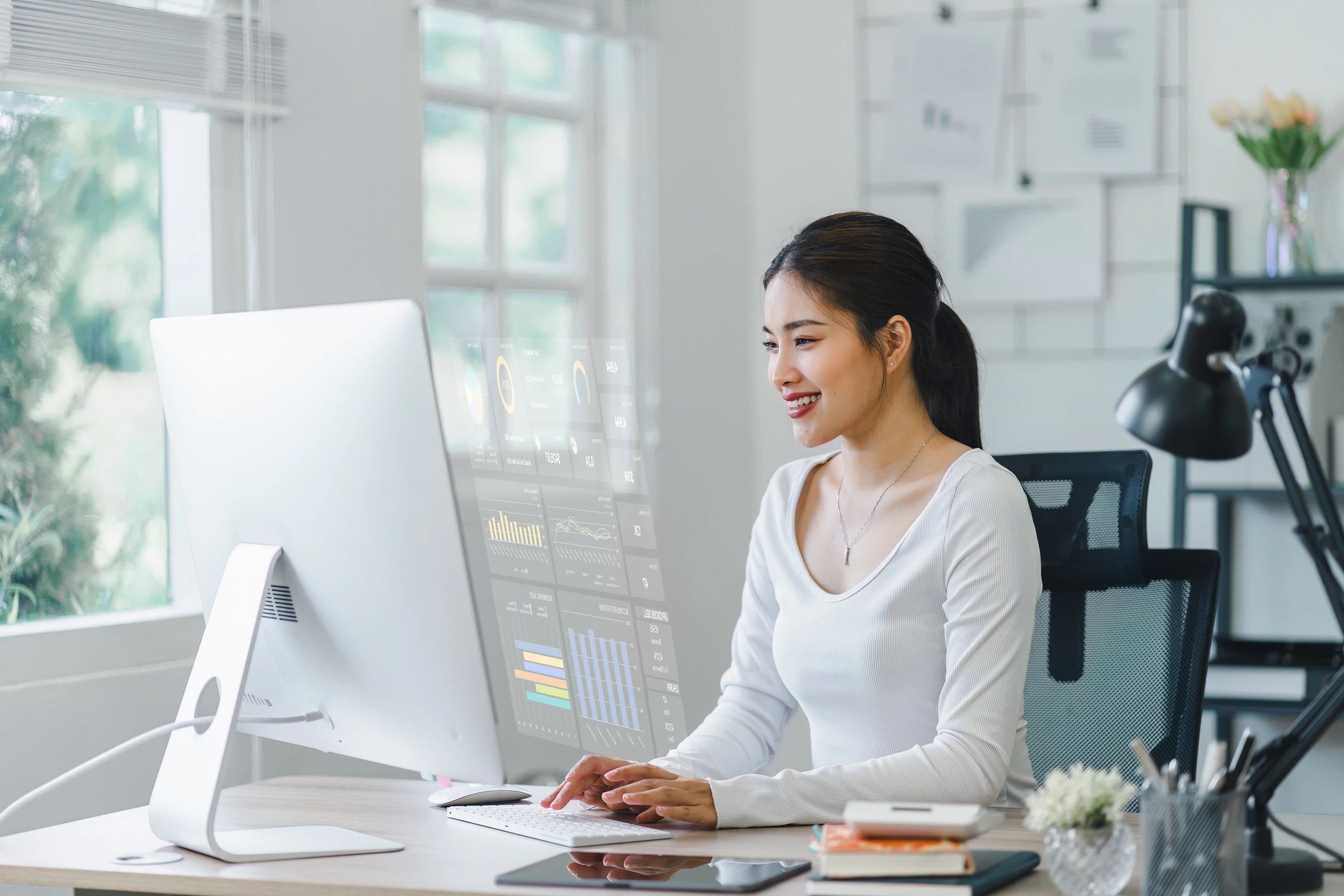 Professional woman working at computer workstation